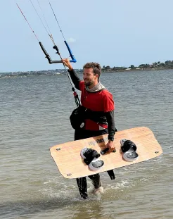 Instructor returns to the beach after kitesurfing session